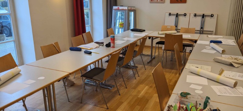 Empty event room with five tower puzzles on some tables